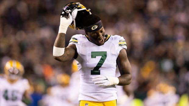 Packers linebacker Quay Walker (7) runs out of the tunnel for a game against the Eagles.